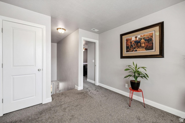 802 W 1060 S, Logan, UT 84321 - unfurnished bedroom with baseboards, visible vents, carpet flooring, and a textured ceiling