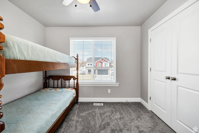 802 W 1060 S, Logan, UT 84321 - carpeted bedroom with baseboards, visible vents, a textured ceiling, and a ceiling fan