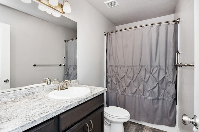 802 W 1060 S, Logan, UT 84321 - bathroom featuring visible vents, curtained shower, toilet, and vanity