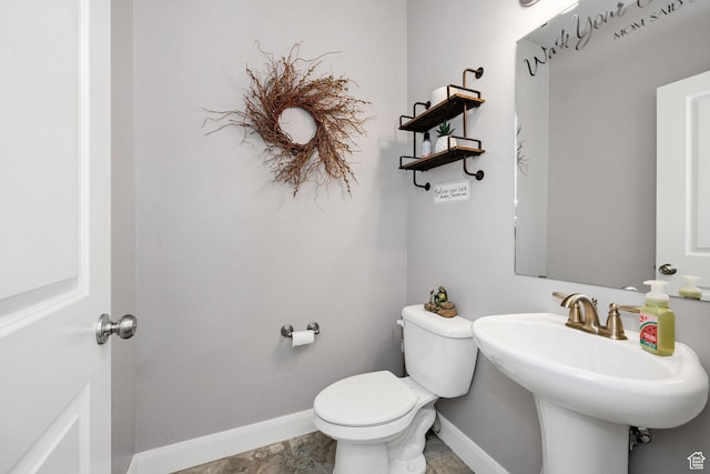 802 W 1060 S, Logan, UT 84321 - bathroom with toilet, a sink, and baseboards