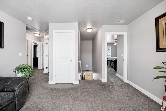 802 W 1060 S, Logan, UT 84321 - living area with baseboards, visible vents, carpet flooring, and a textured ceiling