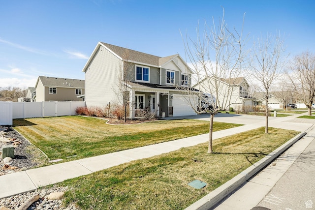 802 W 1060 S, Logan, UT 84321 - traditional-style home featuring a front yard, fence, a garage, and concrete driveway