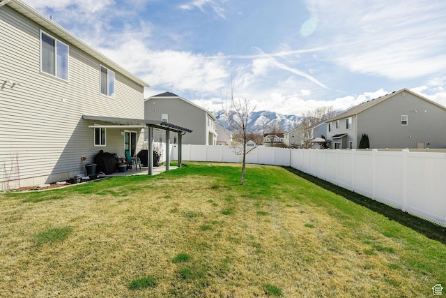 802 W 1060 S, Logan, UT 84321 - view of yard featuring a fenced backyard, a mountain view, a residential view, and a patio area