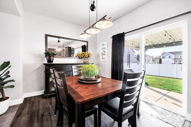 802 W 1060 S, Logan, UT 84321 - dining area featuring dark wood finished floors, baseboards, and visible vents