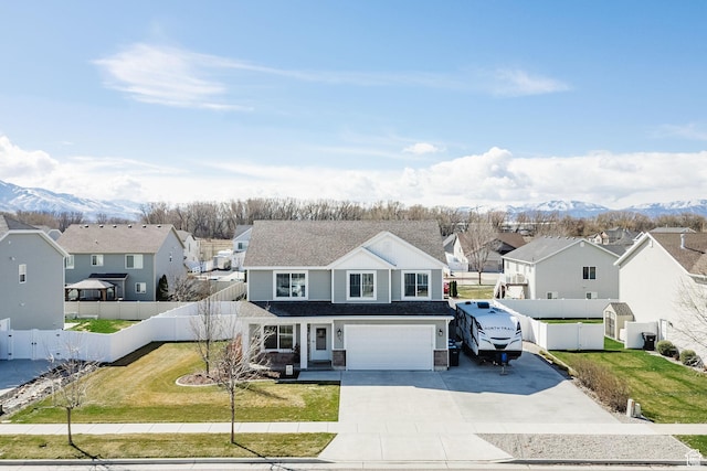 802 W 1060 S, Logan, UT 84321 - traditional-style house with a front lawn, a residential view, fence, and a garage