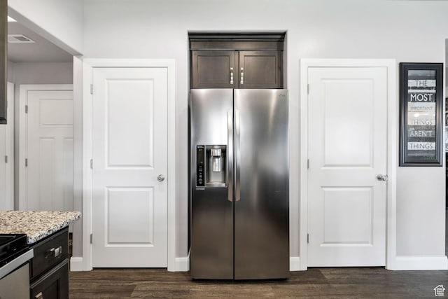 802 W 1060 S, Logan, UT 84321 - kitchen with light stone countertops, appliances with stainless steel finishes, baseboards, dark wood-type flooring, and dark brown cabinets