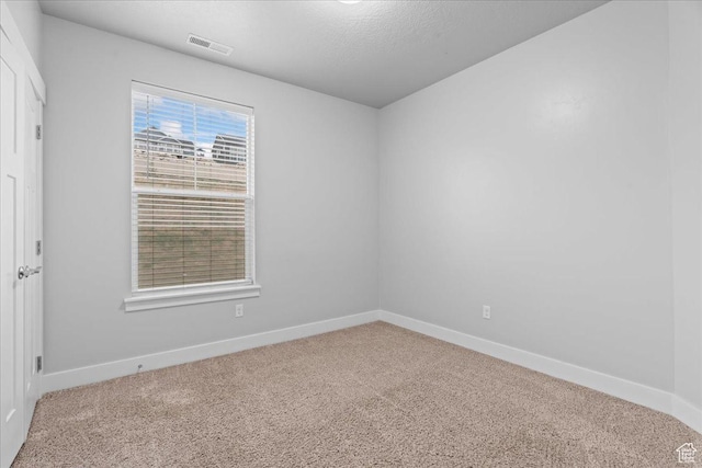 1816 W Eaglewood Dr Unit 101, Saratoga Springs, UT 84045 - unfurnished room with baseboards, visible vents, and carpet