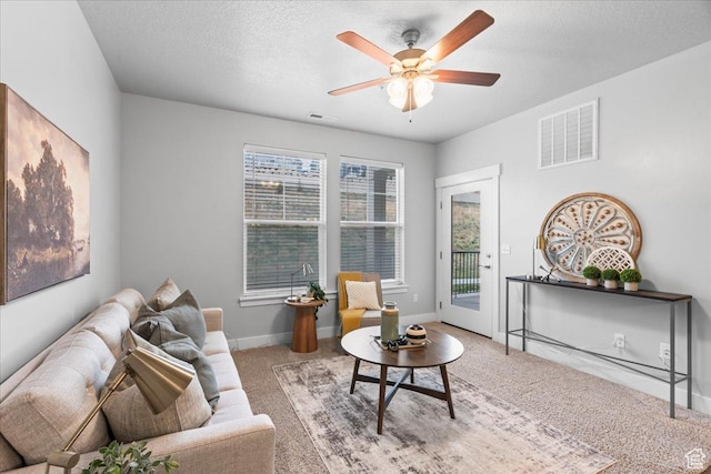 1816 W Eaglewood Dr Unit 101, Saratoga Springs, UT 84045 - living area featuring a ceiling fan, carpet, a textured ceiling, and visible vents