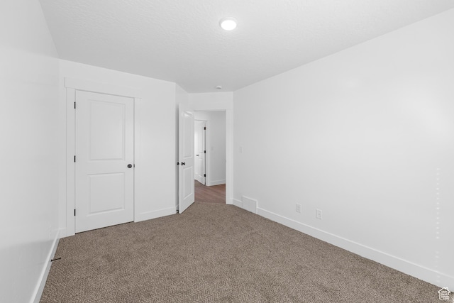1651 E 900 N Unit 16, Spanish Fork, UT 84660 - carpeted spare room featuring a textured ceiling, baseboards, and visible vents