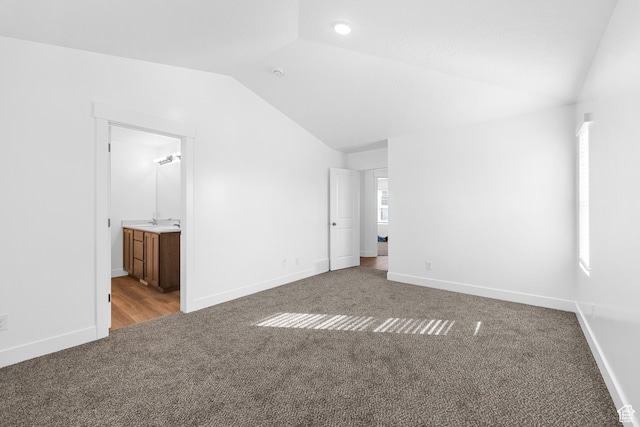 1651 E 900 N Unit 16, Spanish Fork, UT 84660 - unfurnished bedroom with baseboards, carpet, lofted ceiling, and connected bathroom