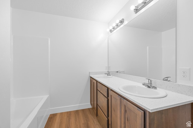 1651 E 900 N Unit 16, Spanish Fork, UT 84660 - full bath featuring wood finished floors, double vanity, a sink, and baseboards