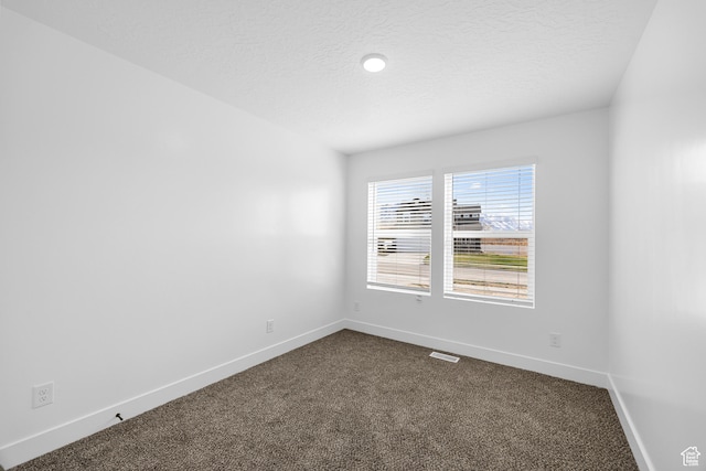 1651 E 900 N Unit 16, Spanish Fork, UT 84660 - empty room featuring dark carpet, baseboards, visible vents, and a textured ceiling