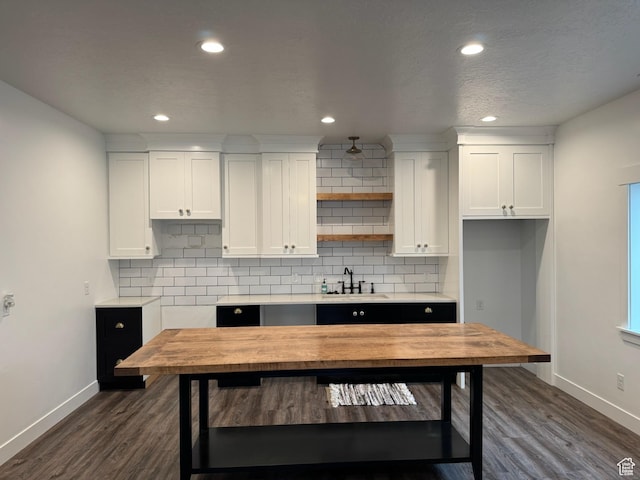 142 S 3500 W, Maeser, UT 84078 - kitchen with white cabinetry, backsplash, a sink, and dark wood-style flooring