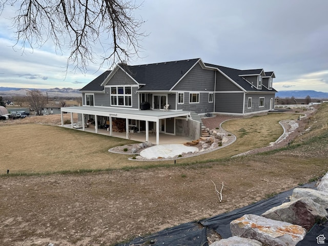 142 S 3500 W, Maeser, UT 84078 - back of house with a patio area and a mountain view