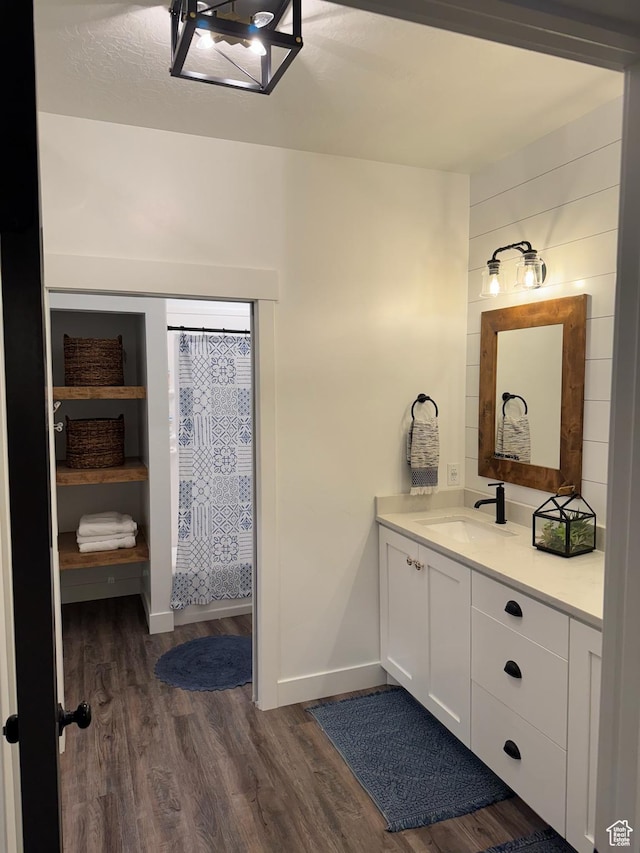 142 S 3500 W, Maeser, UT 84078 - bathroom featuring a shower with curtain, vanity, baseboards, and wood finished floors