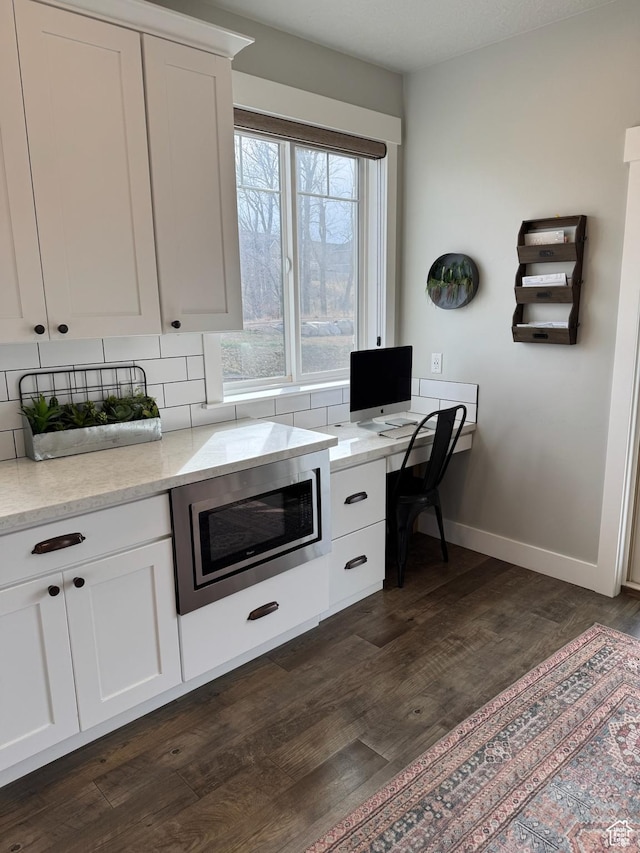 142 S 3500 W, Maeser, UT 84078 - kitchen with baseboards, stainless steel microwave, tasteful backsplash, dark wood-type flooring, and white cabinetry