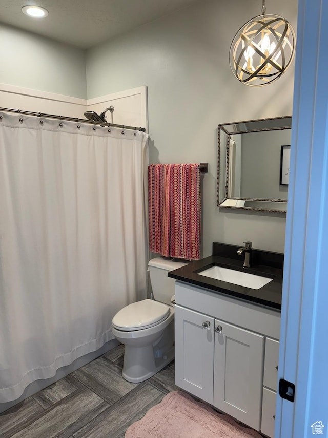 142 S 3500 W, Maeser, UT 84078 - full bath with a shower with shower curtain, toilet, vanity, wood finished floors, and recessed lighting