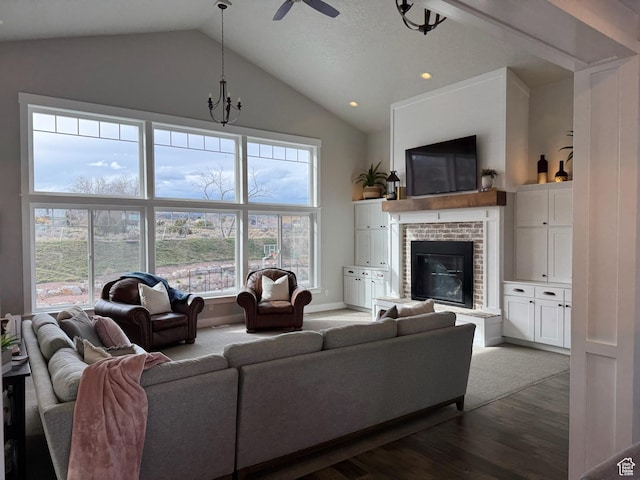 142 S 3500 W, Maeser, UT 84078 - living room featuring high vaulted ceiling, ceiling fan with notable chandelier, a brick fireplace, dark wood-style floors, and baseboards