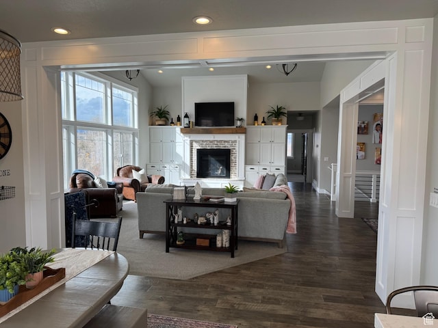 142 S 3500 W, Maeser, UT 84078 - living room featuring a glass covered fireplace, recessed lighting, and dark wood finished floors