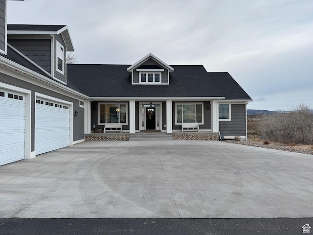 142 S 3500 W, Maeser, UT 84078 - view of front of property with a porch, driveway, a garage, and roof with shingles