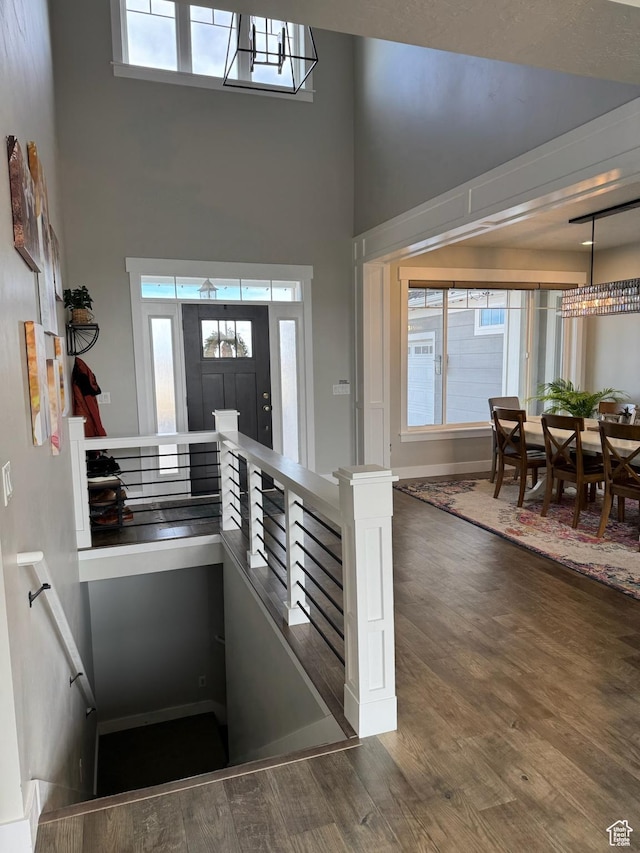 142 S 3500 W, Maeser, UT 84078 - entryway with an inviting chandelier, a towering ceiling, and wood finished floors