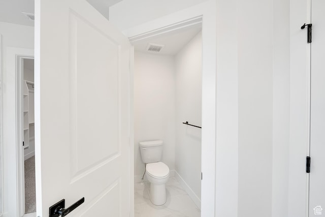 6161 W Teton Ranch Dr Unit 342, Herriman, UT 84096 - bathroom with toilet, marble look tiles, and baseboards