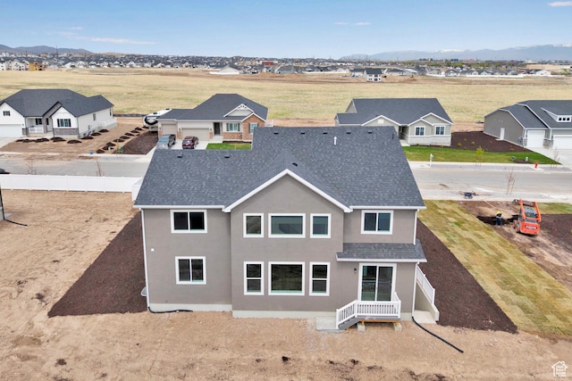 6161 W Teton Ranch Dr Unit 342, Herriman, UT 84096 - back of property featuring stucco siding, roof with shingles, and a mountain view