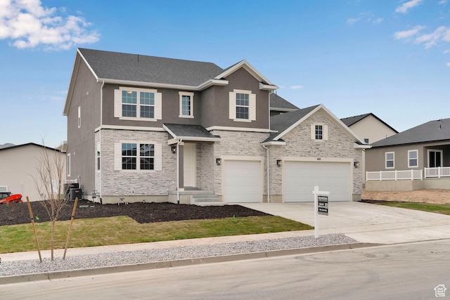 6161 W Teton Ranch Dr Unit 342, Herriman, UT 84096 - traditional-style house featuring stone siding, concrete driveway, an attached garage, and stucco siding