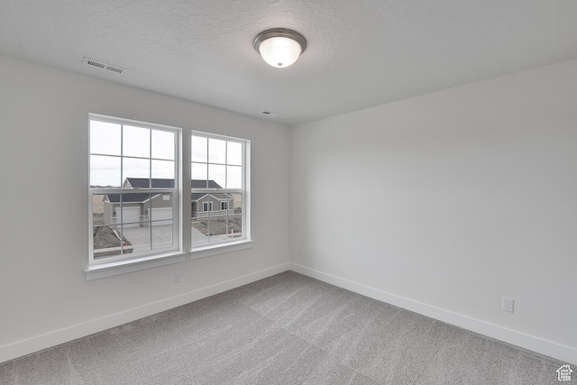 6161 W Teton Ranch Dr Unit 342, Herriman, UT 84096 - spare room with baseboards, carpet floors, and a textured ceiling