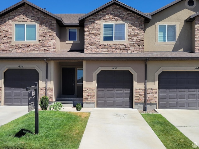 652 W Pimlico Dr, Saratoga Springs, UT 84045 - view of property with stone siding, stucco siding, and a front yard