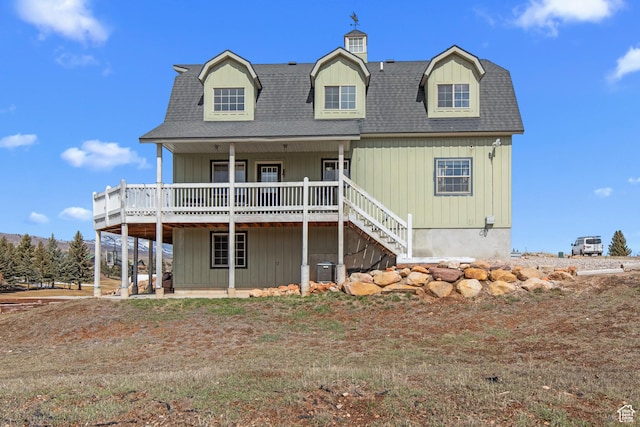 2599 S Foxridge Rd, Garden City, UT 84028 - back of house featuring central AC, a shingled roof, and a deck
