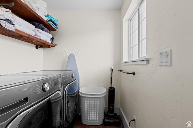 2599 S Foxridge Rd, Garden City, UT 84028 - laundry area with baseboards, separate washer and dryer, and laundry area
