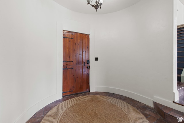 2599 S Foxridge Rd, Garden City, UT 84028 - foyer with baseboards and stone tile flooring