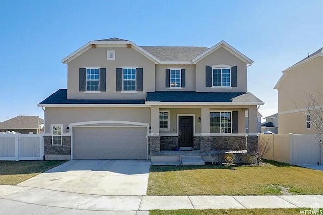 craftsman-style house with fence, an attached garage, a front lawn, stone siding, and stucco siding
