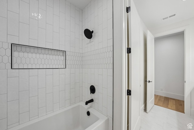 13042 N Prospector Way, Alpine, UT 84004 - bathroom featuring baseboards and washtub / shower combination