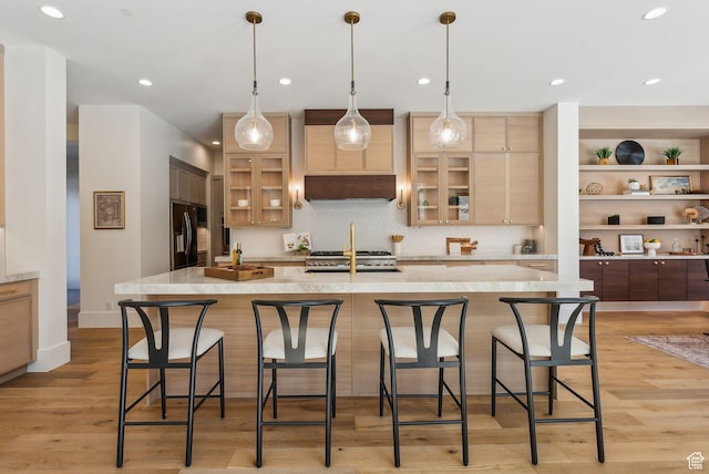 13042 N Prospector Way, Alpine, UT 84004 - kitchen featuring black fridge, glass insert cabinets, decorative backsplash, light wood-style floors, and recessed lighting