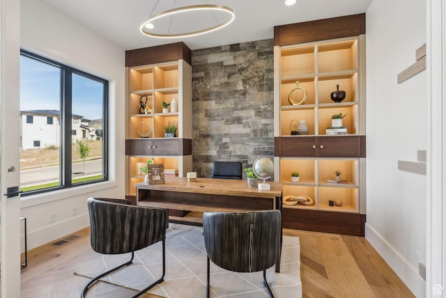 13042 N Prospector Way, Alpine, UT 84004 - home office with wood finished floors, baseboards, and healthy amount of natural light