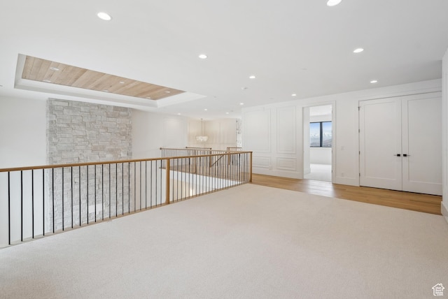 13042 N Prospector Way, Alpine, UT 84004 - spare room with a tray ceiling, recessed lighting, and wood finished floors