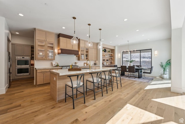 13042 N Prospector Way, Alpine, UT 84004 - kitchen featuring light countertops, light wood-type flooring, a sink, stainless steel double oven, and recessed lighting