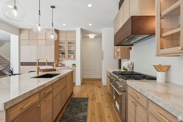 13042 N Prospector Way, Alpine, UT 84004 - kitchen with a sink, high end stainless steel range oven, light wood finished floors, recessed lighting, and glass insert cabinets