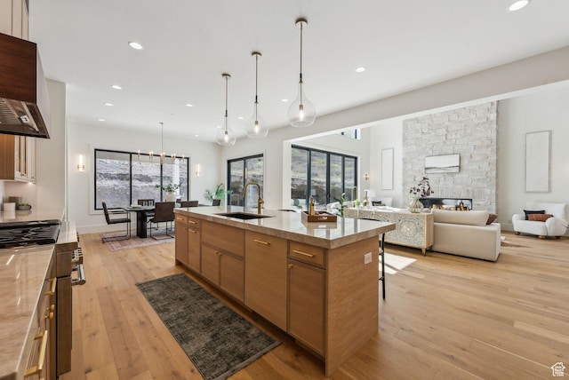 13042 N Prospector Way, Alpine, UT 84004 - kitchen with a sink, light wood finished floors, custom range hood, recessed lighting, and a spacious island