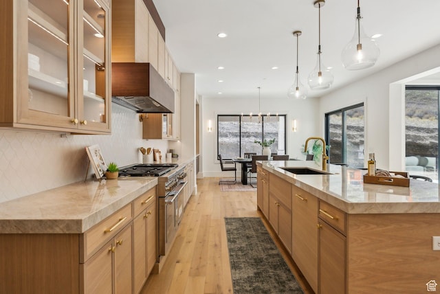 13042 N Prospector Way, Alpine, UT 84004 - kitchen with a sink, high end stainless steel range, recessed lighting, backsplash, and light wood finished floors