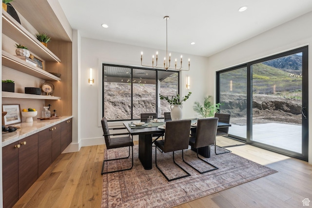 13042 N Prospector Way, Alpine, UT 84004 - dining space featuring light wood-style floors, a chandelier, recessed lighting, and baseboards