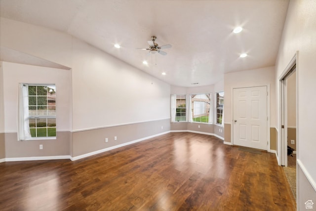 unfurnished room with lofted ceiling, recessed lighting, baseboards, a ceiling fan, and wood finished floors