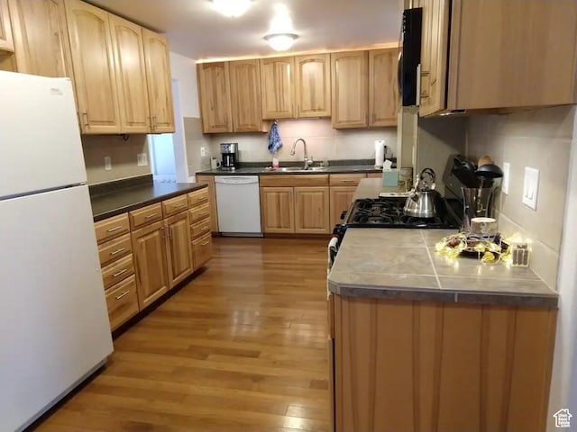 8 S 400 W, Blanding, UT 84511 - kitchen featuring a sink, light brown cabinetry, light wood finished floors, and white appliances
