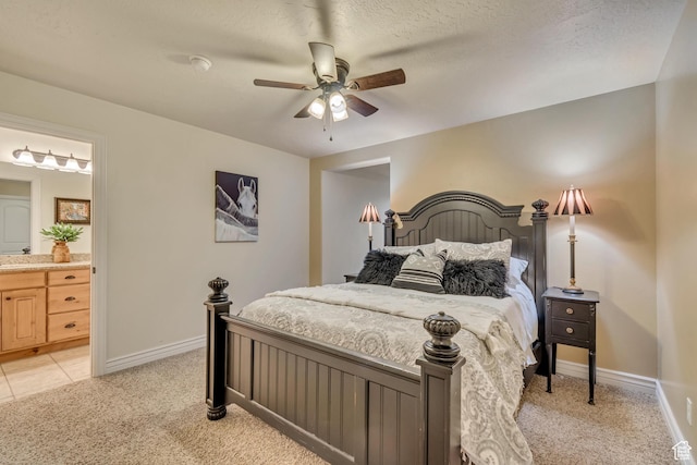 12483 N Timberline Dr, Highland, UT 84003 - bedroom featuring light colored carpet, ceiling fan, baseboards, and ensuite bath