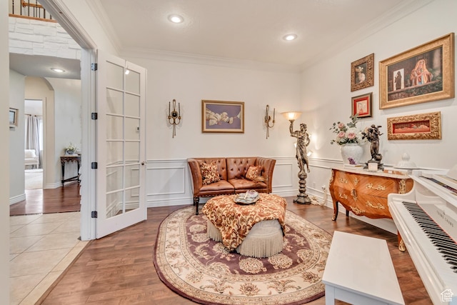 12483 N Timberline Dr, Highland, UT 84003 - sitting room with a decorative wall, ornamental molding, wood finished floors, arched walkways, and wainscoting