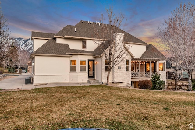 12483 N Timberline Dr, Highland, UT 84003 - rear view of property featuring a chimney, cooling unit, stucco siding, a pergola, and a yard