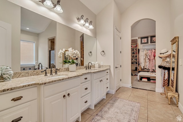 12483 N Timberline Dr, Highland, UT 84003 - full bath with tile patterned floors, a walk in closet, double vanity, and a sink