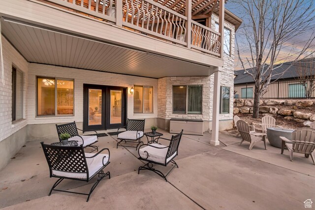 12483 N Timberline Dr, Highland, UT 84003 - view of patio / terrace featuring a balcony, a fire pit, and french doors